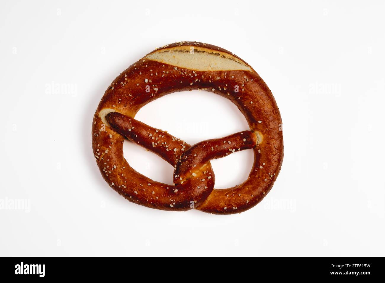 German pretzel with salt isolated on white background. Stock Photo