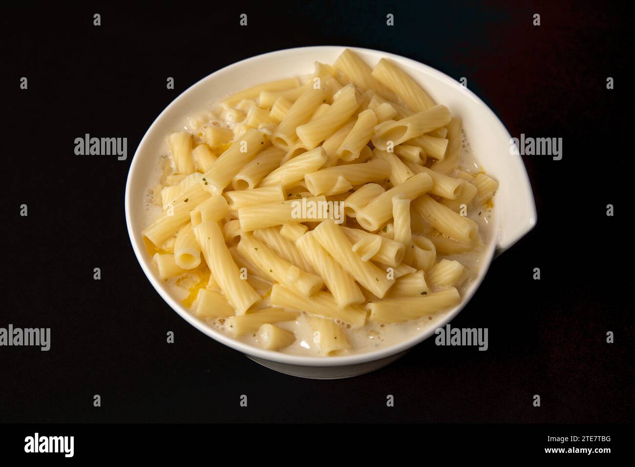 Top View if a Portion of Macaroni and Cheese in a white bowl Stock Photo