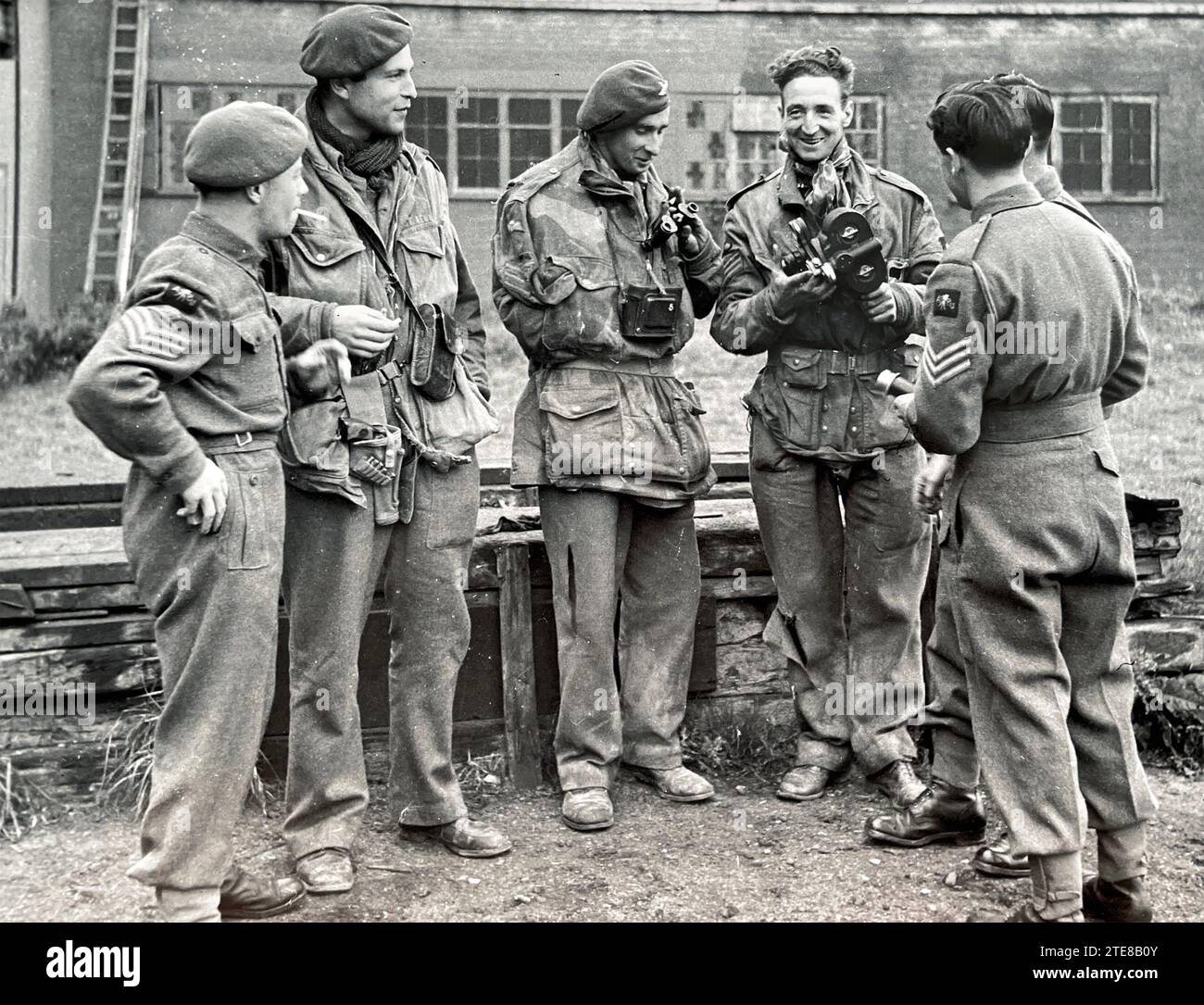 OPERATION MARKET GARDEN  September 1944. The operation was covered by three members of the Army Film and Photographic Unit  seen here facing camera back at AFPU HQ at Pinewood Studios on 28 September.  From left: Sgts  D.M.Smith, G. Walker, C.M.Lewis. Stock Photo