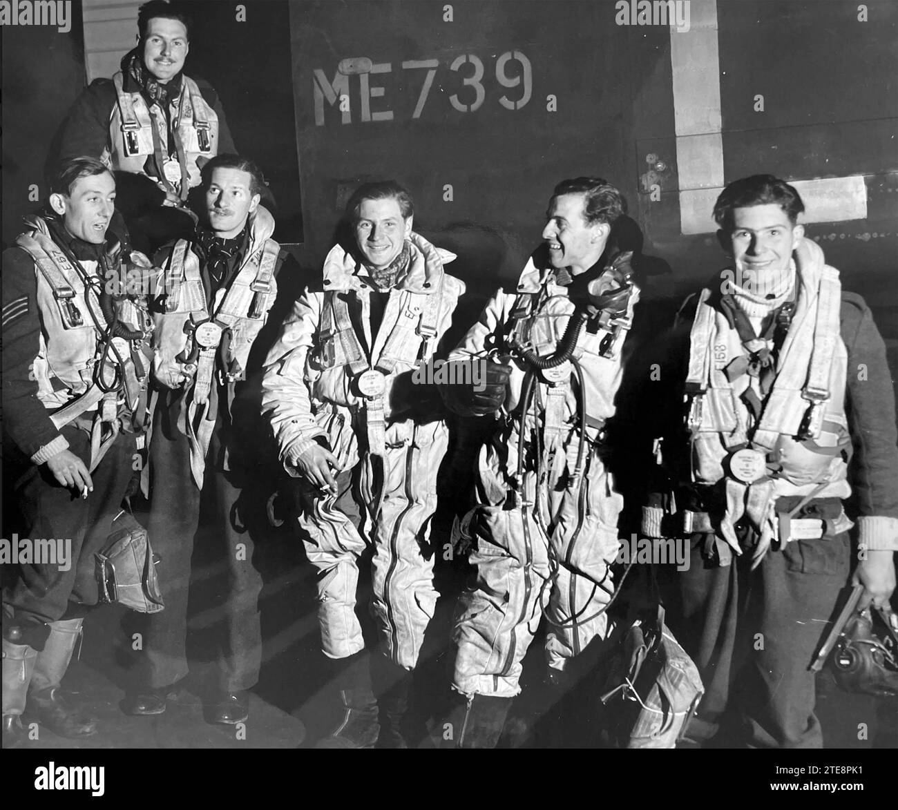 LANCASTER crew of 63o Squadron RAF return to their East Kirkby, Lincolnshire, base after a successful raid in mid 1944. Stock Photo