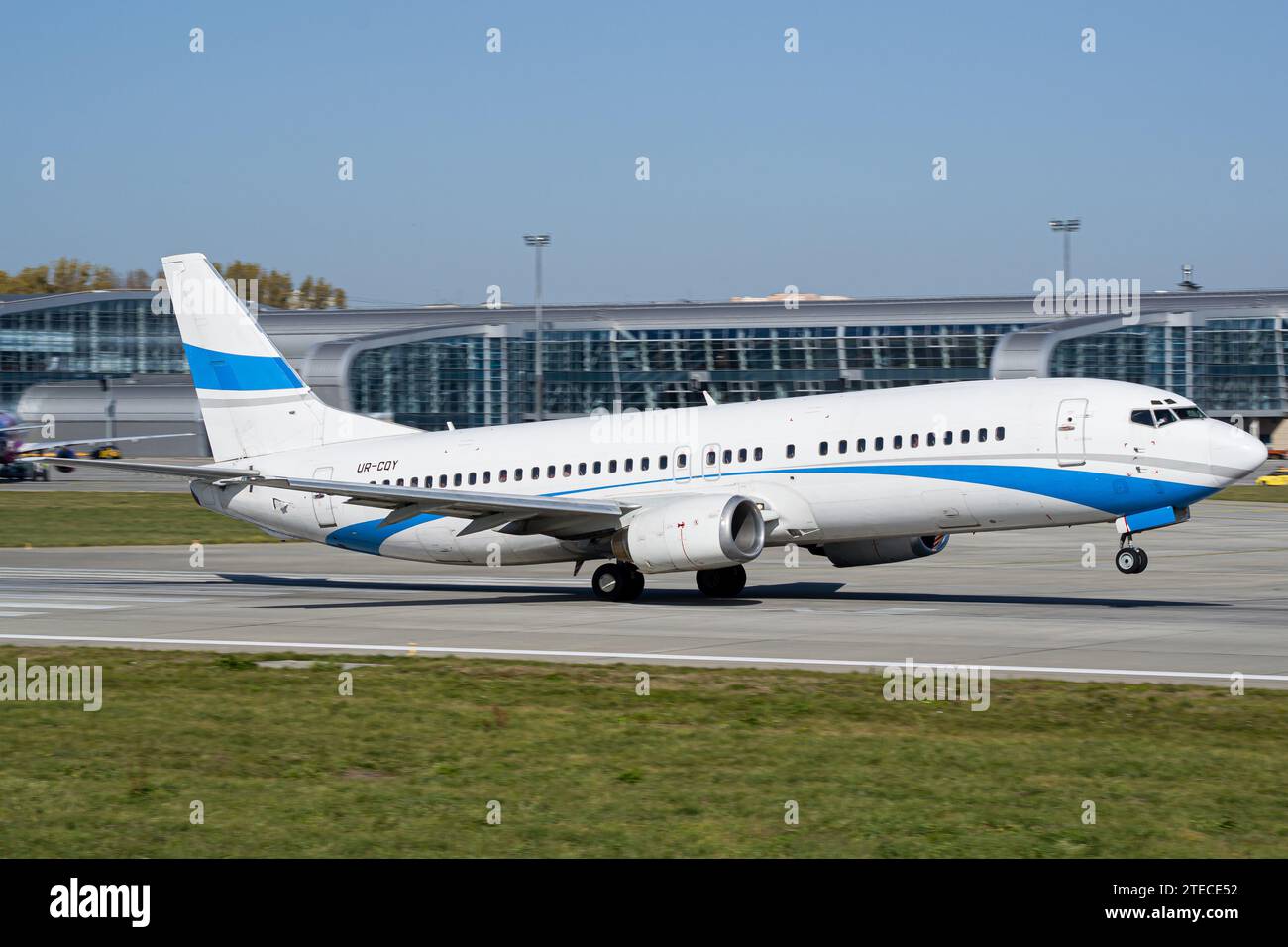 White and blue unbranded passenger aircraft taking off. No trademark Stock Photo
