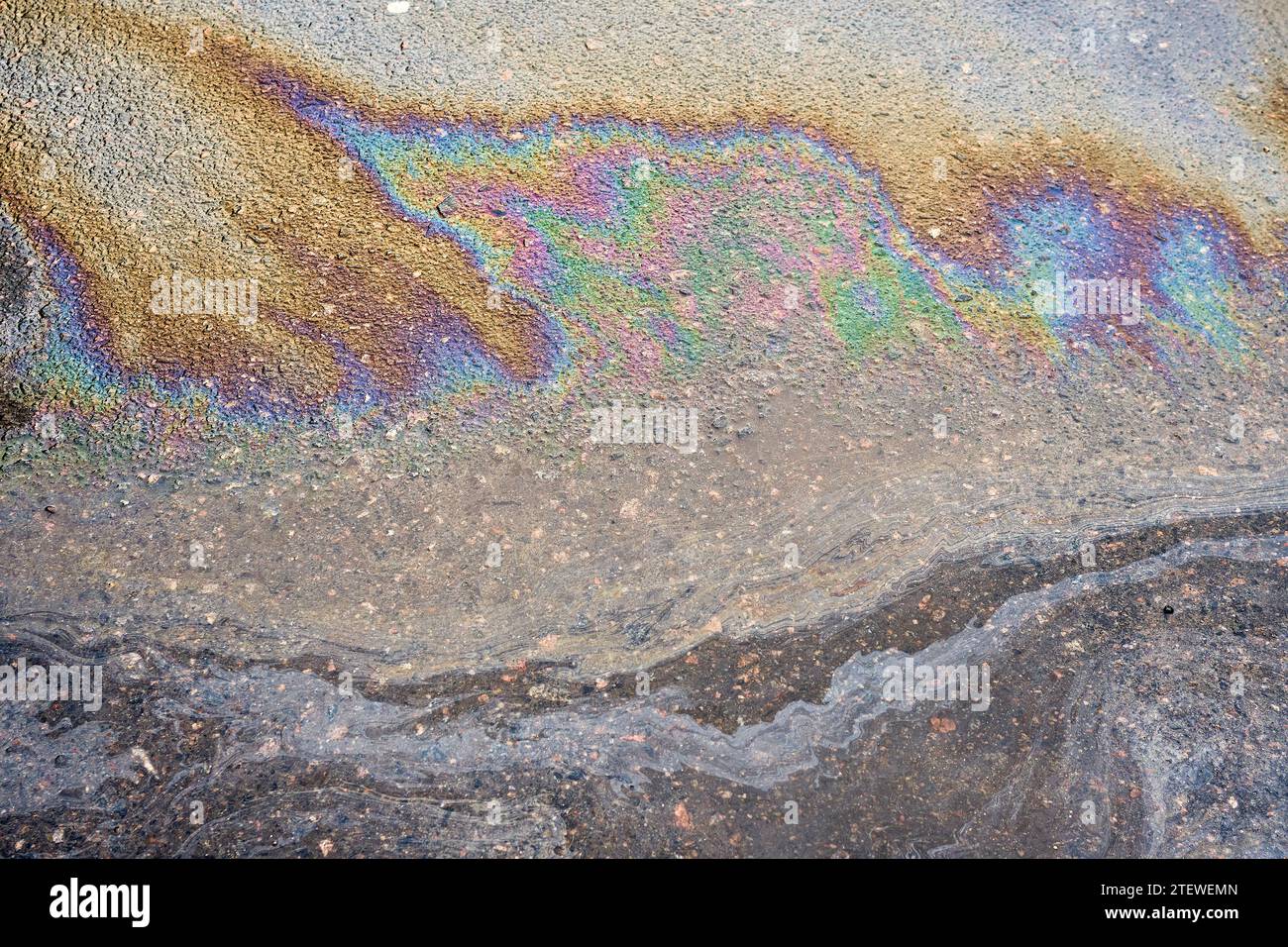 Multi colored oil spill on asphalt road, abstract background Stock ...