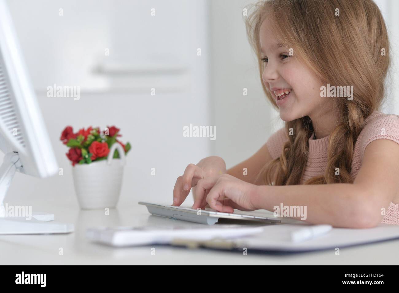 Cute and happy little girl children using laptop computer Stock Photo ...