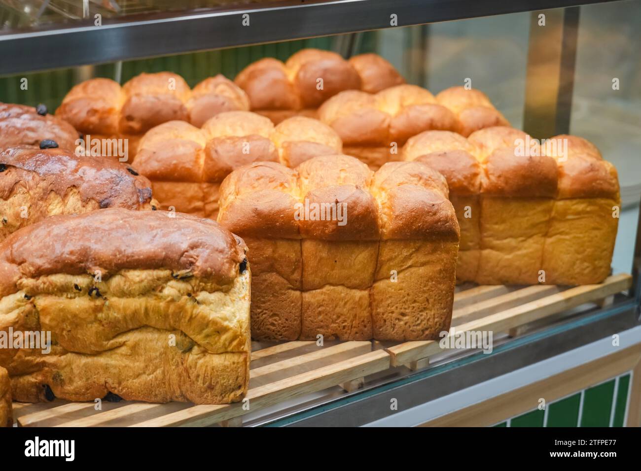Soft fluffy white bread loaf, Japanese milk bread on display in a store. Stock Photo