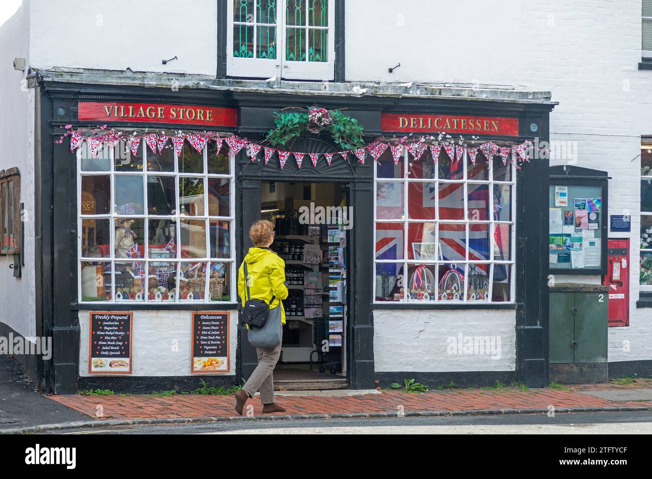 Village Store, woman, market square, Alfriston, East Sussex, England, Great Britain Stock Photo