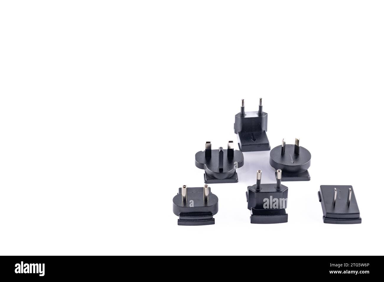 European, Chinese, American electrical socket plug on white table Stock