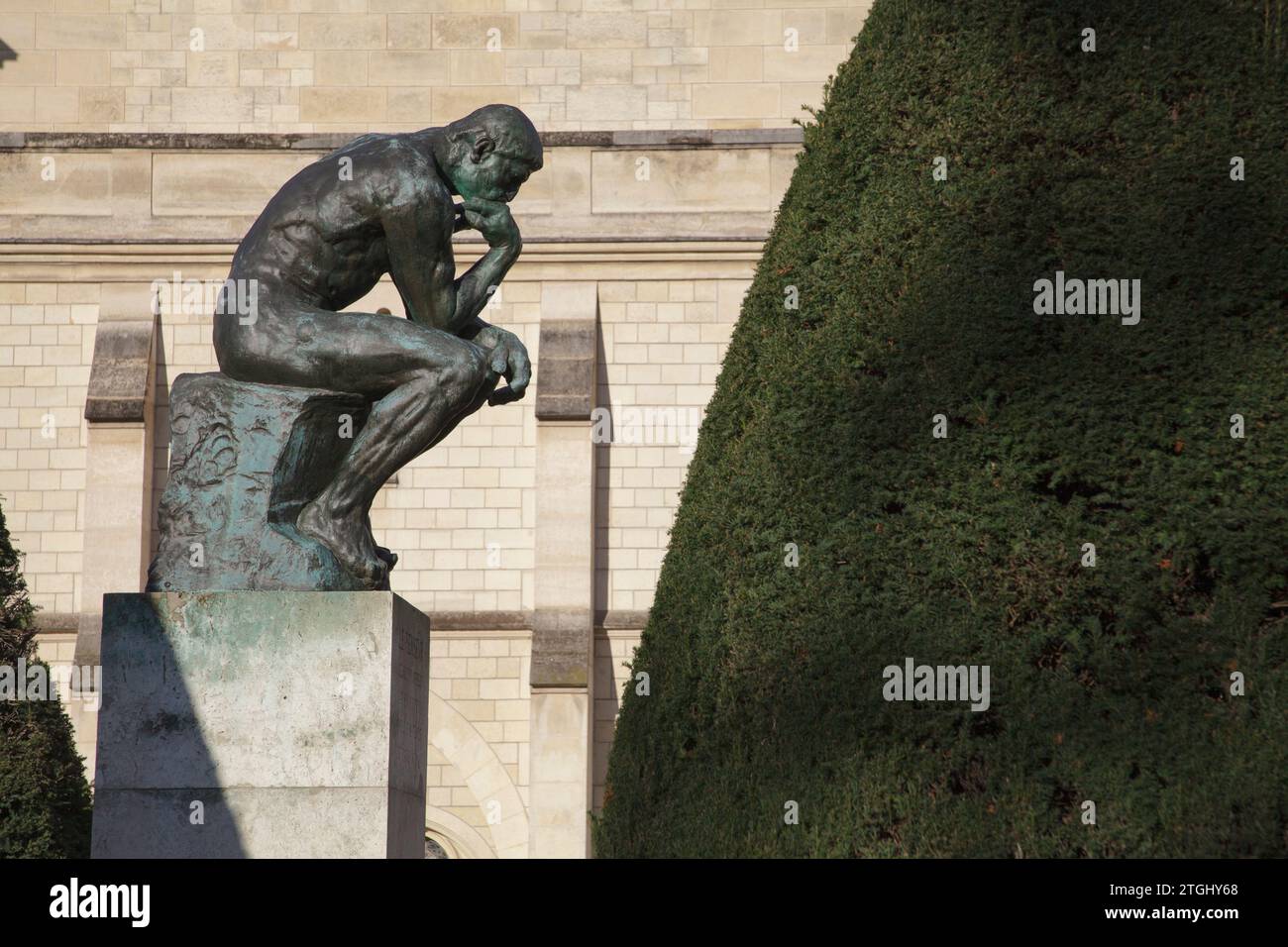 A cast of The Thinker, an iconic sculpture by Rodin in the gardens at Musée Rodin in Paris, France Stock Photo
