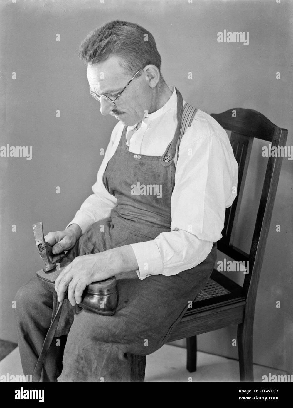 Fixing a pair of shoes hi-res stock photography and images - Alamy