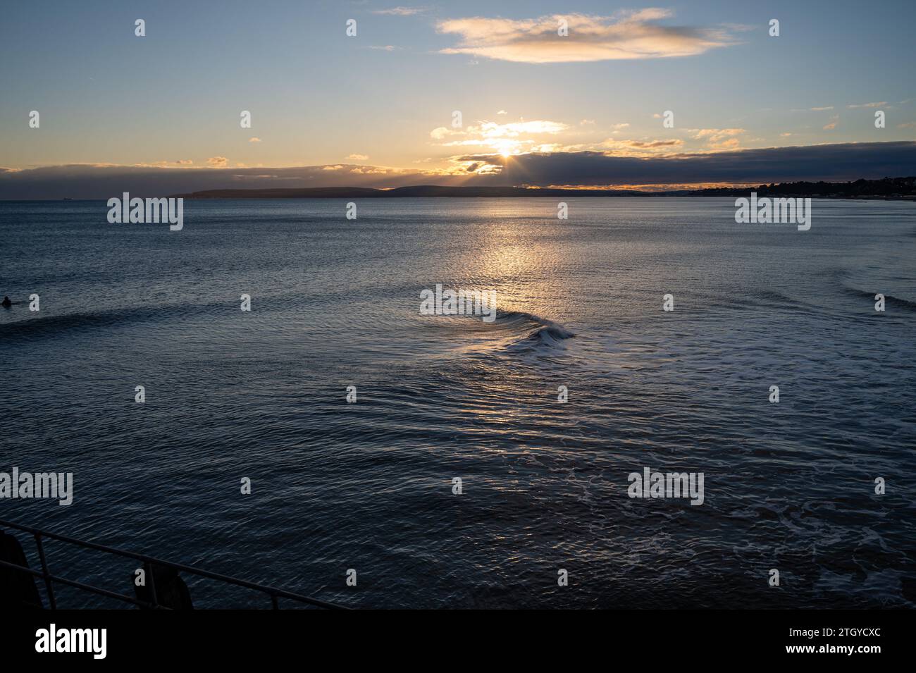 waves at Bournemouth backlit sunset Stock Photo