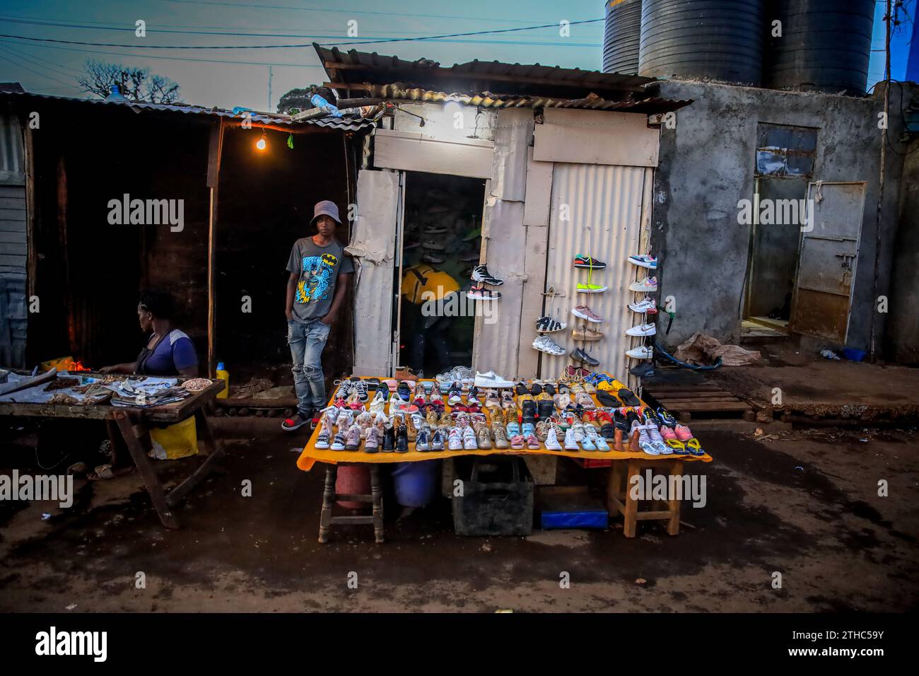 Hawkers selling second hand shoes by the busy streets in Kibera Slum