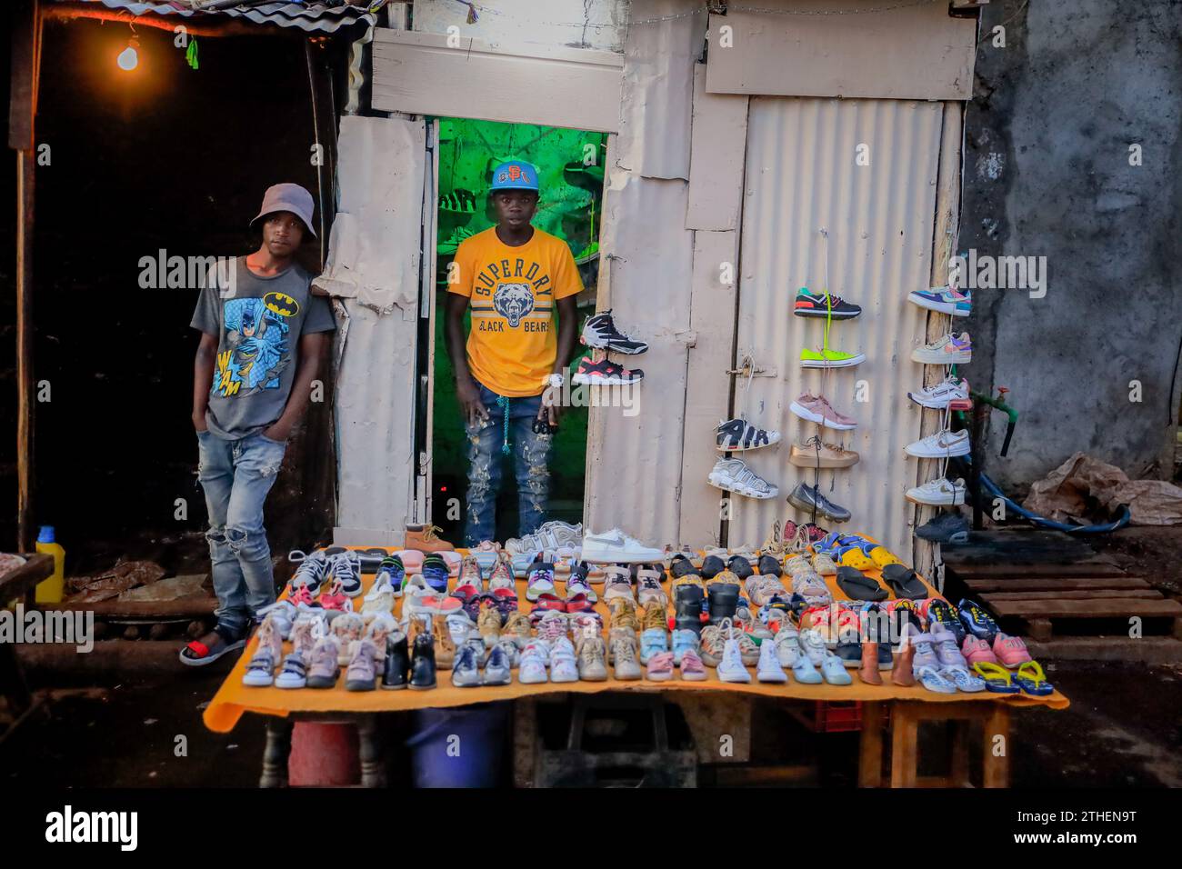 Hawkers selling second hand shoes by the busy streets in Kibera Slum