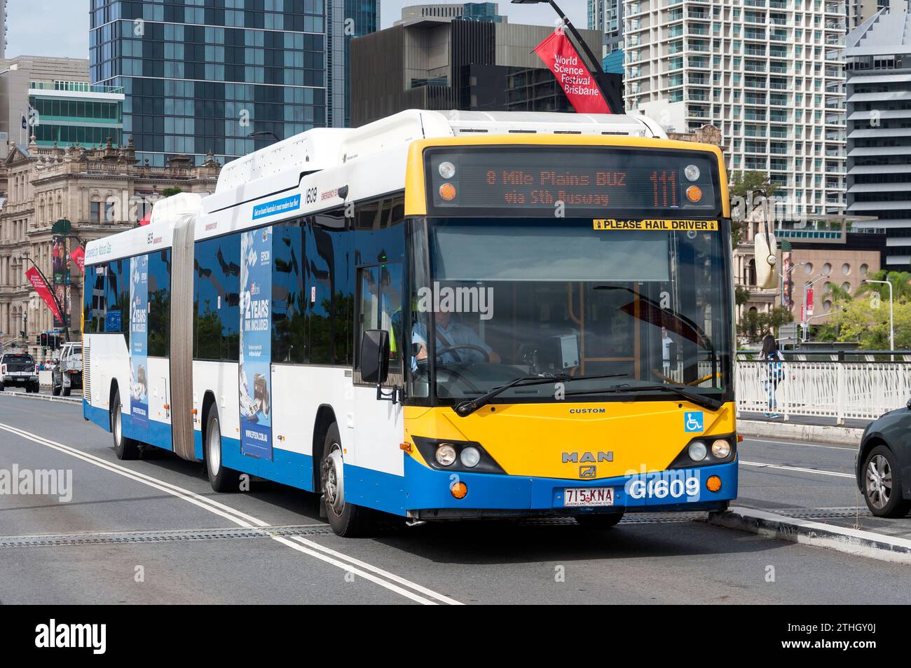 Local natural gas bus crossing Victoria Bridge, Brisbane City, Brisbane, Queensland, Australia Stock Photo