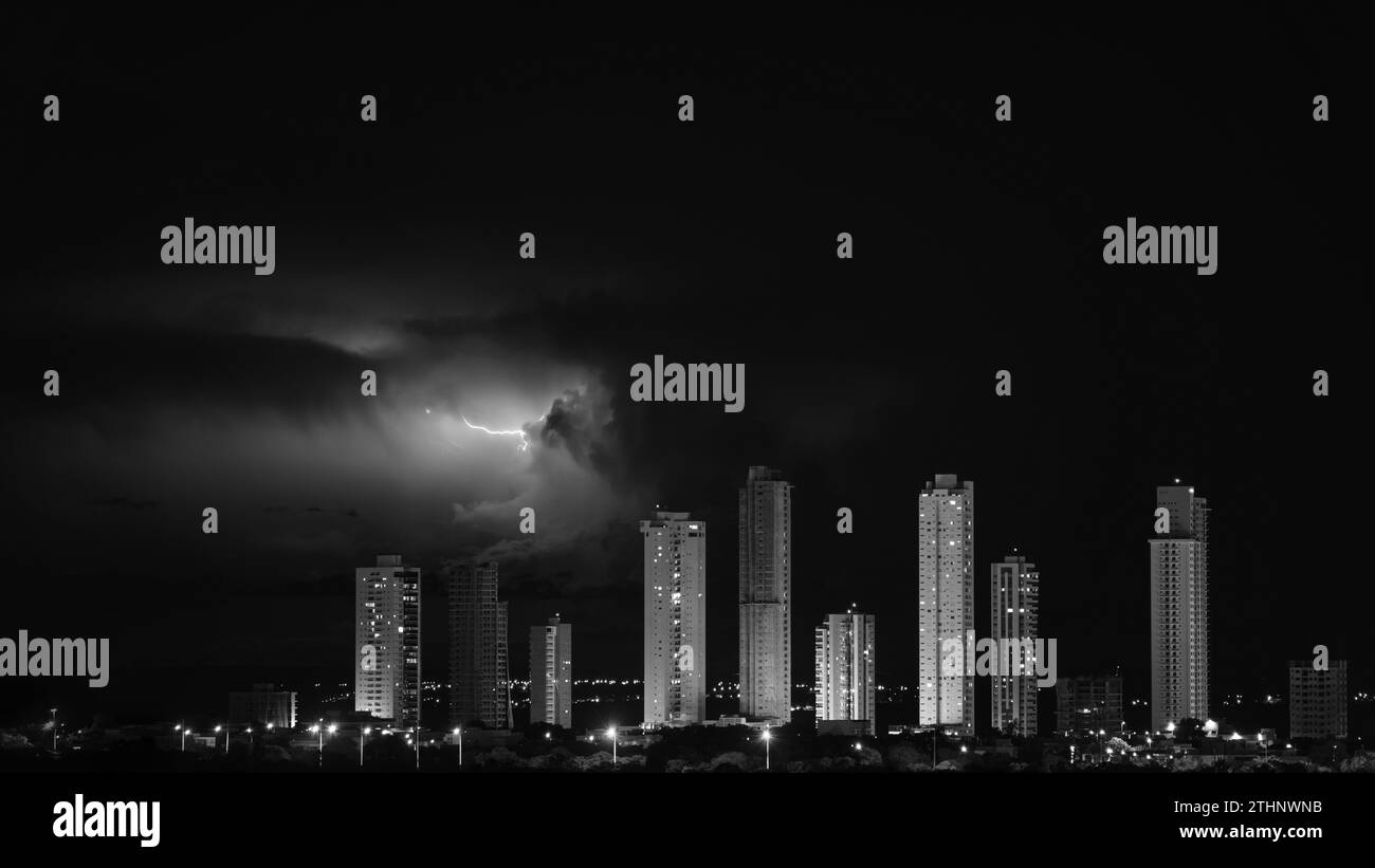Monochrome Skyscrapers Forming a Barrier Against Electric Storm Stock Photo