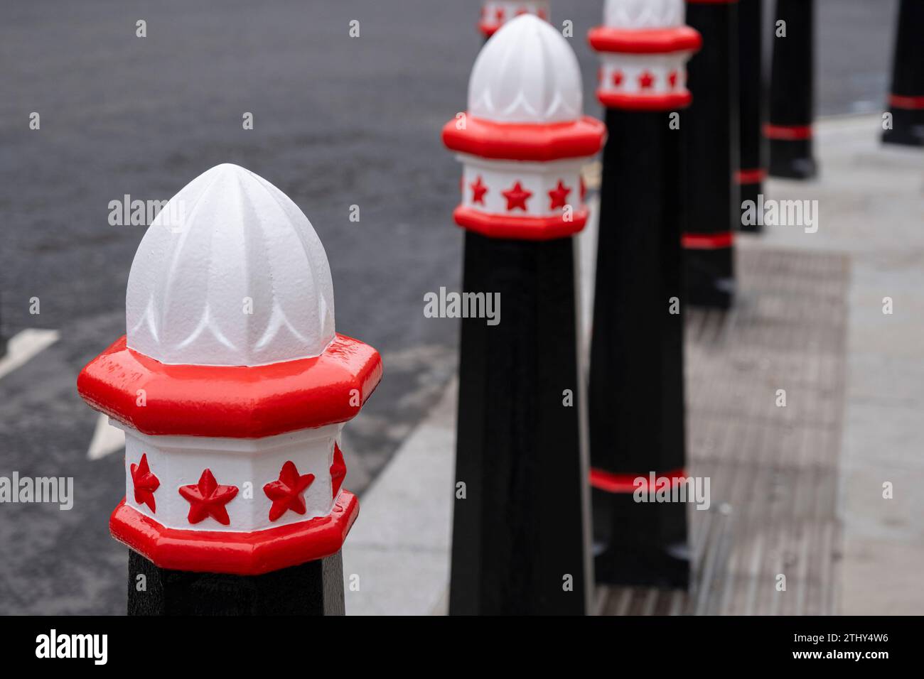 Red white and black bollards in the City of London on 7th December 2023 in London, United Kingdom. The City of London is a city, ceremonial county and local government district that contains the primary central business district CBD of London. The City of London is widely referred to simply as the City is also colloquially known as the Square Mile. Stock Photo