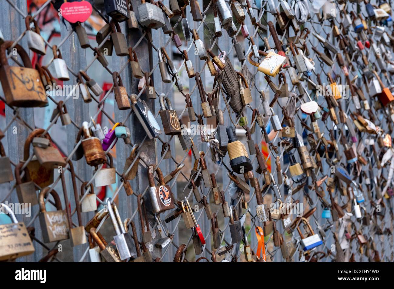 Lovers padlocks attached to a fence in Shoreditch on 7th December 2023