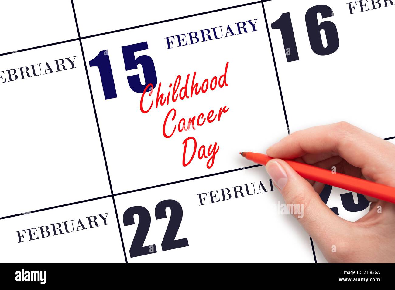 February 15. Hand writing text Childhood Cancer Day on calendar date. Save the date. Holiday. Day of the year concept. Stock Photo