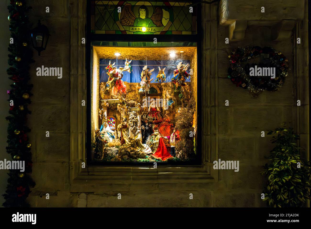 Elaborately decorated nativity scene in the window of a private house