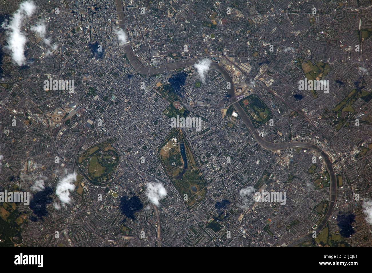 London, England seen from the International Space on July 4th 2014. Taken from an altitude of 221 nautical miles using an 800mm lens. The capital of the United Kingdom. The River Thames and the urban parks (Regents Park centre) are clearly visible.  An Optimised version of an original NASA image / Credit: NASA Stock Photo