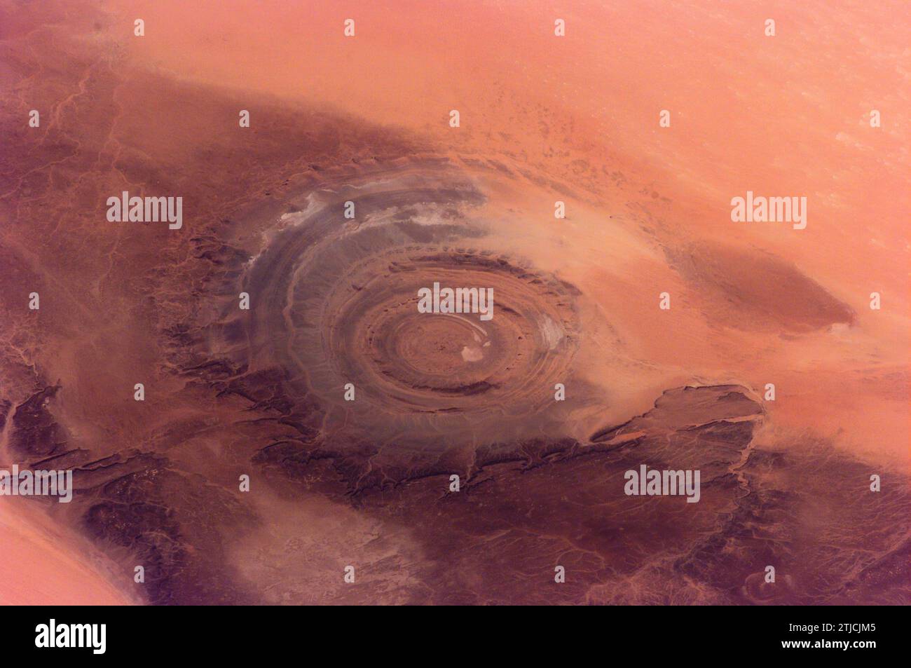 The 'bull's-eye' of the Richat Structure in the Gres de Chinguetti Plateau in central Mauritania in northwest Africa is featured in this photo taken by an Expedition 2 crew member on the International Space Station in April 2001. It represents uplifted, layered rocks that have been eroded by water and wind into the present shape. The 25-mile-wide structure is a 300-foot-deep landmark that has caught the eye of many an astronaut in Earth orbit.  An Optimised version of an original NASA image / Credit: NASA Stock Photo