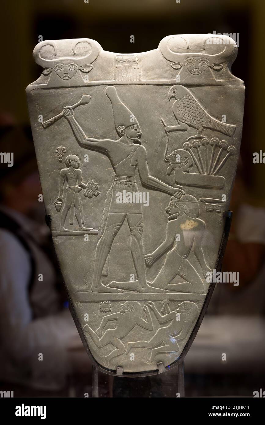 The Narmer Palette is a significant Egyptian archaeological find, dating from about the 31st century BC. It contains some of the earliest hieroglyphic inscriptions ever found. The tablet depicts the unification of Upper and Lower Egypt under the king Narmer. Egyptian Museum, Cairo, Egypt. Stock Photo