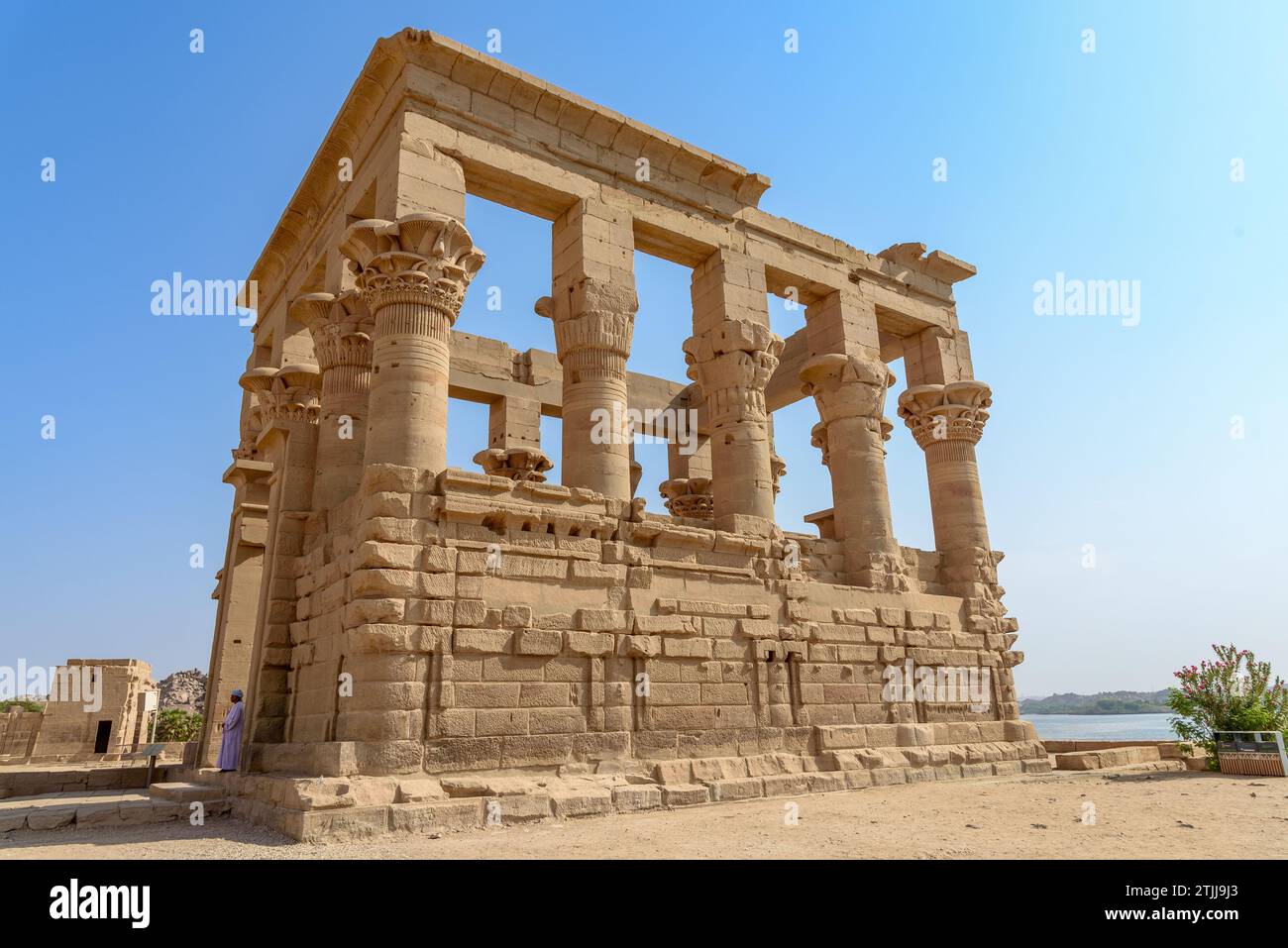 Trajan's Kiosk, also known as Pharaoh's Bed by the locals, is a hypaethral temple currently located on Agilkia Island in southern Egypt. The unfinished monument is attributed to Trajan, Roman emperor from 98 to 117 AD, due to his depiction as pharaoh seen on some of the interior reliefs. Asw‰n Reservoir Colony, Aswan, Egypt. Stock Photo