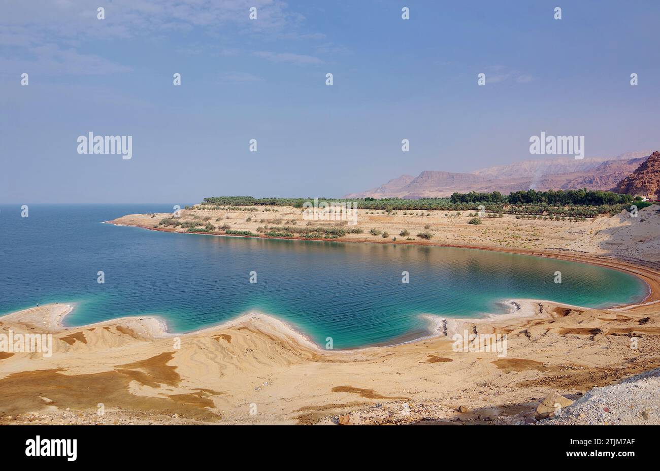 The Dead Sea (Arabic: اَلْبَحْرُ الْمَيْتُ, Āl-Baḥrū l-Maytū; Hebrew: יַם הַמֶּלַח, Yam hamMelaḥ), also known by other names, is a salt lake bordered by Jordan to the east and Palestine's West Bank and Israel to the west. It lies in the Jordan Rift Valley, and its main tributary is the Jordan River.  Credit: JHelebrant Stock Photo