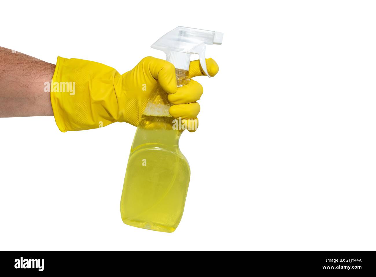 A hand in yellow rubber gloves holds a spray bottle with a cleaning or ...