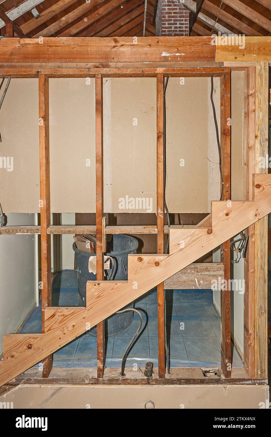Before pics of a house remodel showing staircase framing from hallway ...