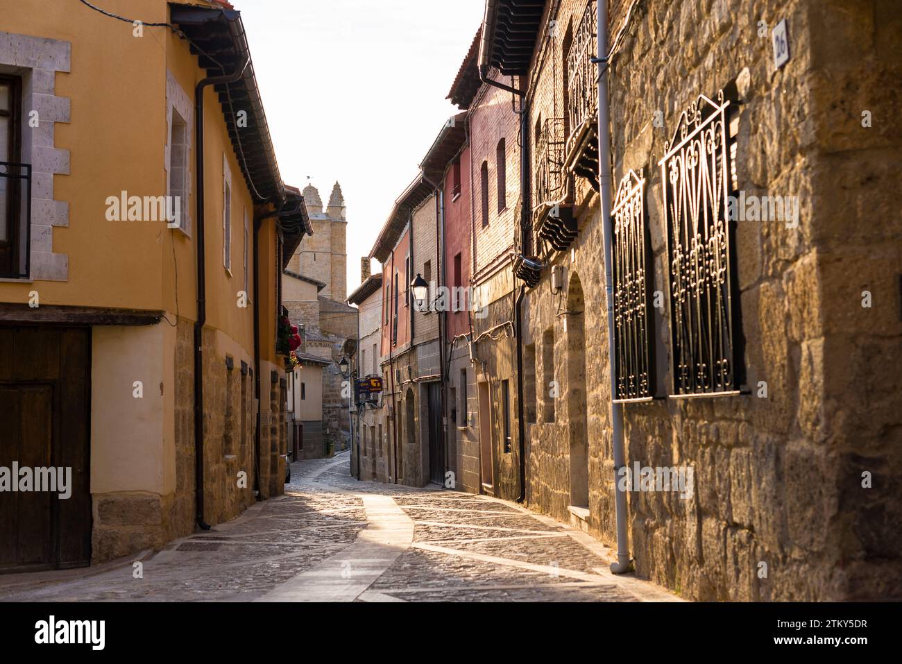 Old terraced houses in the evening sun in the village of Castrojeriz in the North of Spain Stock Photo