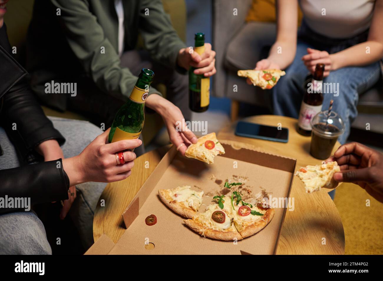 Friends Eating Pizza and Drinking Beer Stock Photo