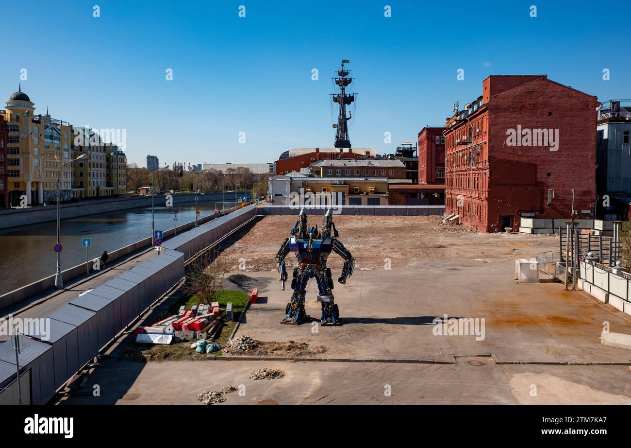 April 29, 2022, Moscow, Russia. A huge statue in the form of a character of the Transformers universe at a construction site on Bolotny Island in the Stock Photo