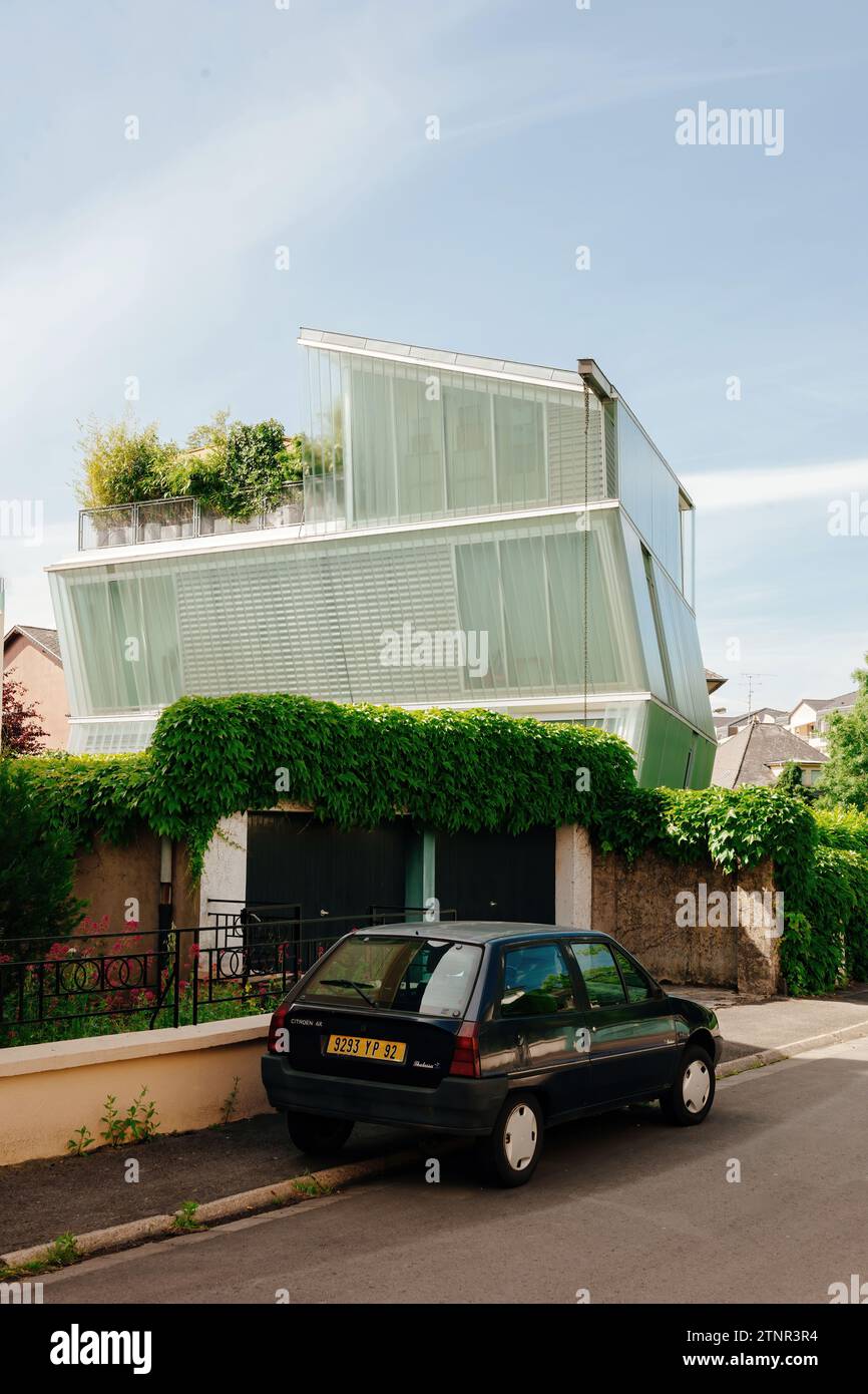 Thionville, France - Jun 10, 2016: Modern house in Thionville with a parked Citroen AX Thalassa in front, reflecting contemporary urban living Stock Photo