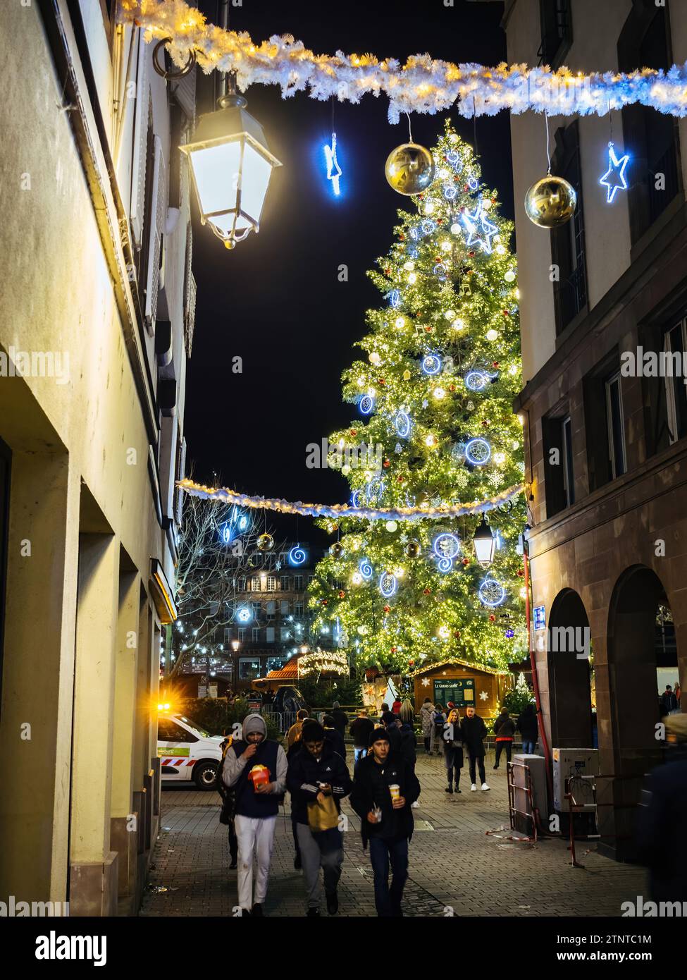 Strasbourg, France - Nov 25, 2022: Experience the magic of the holidays with a low-angle view of a towering Christmas tree in central Place Kleber, fr Stock Photo