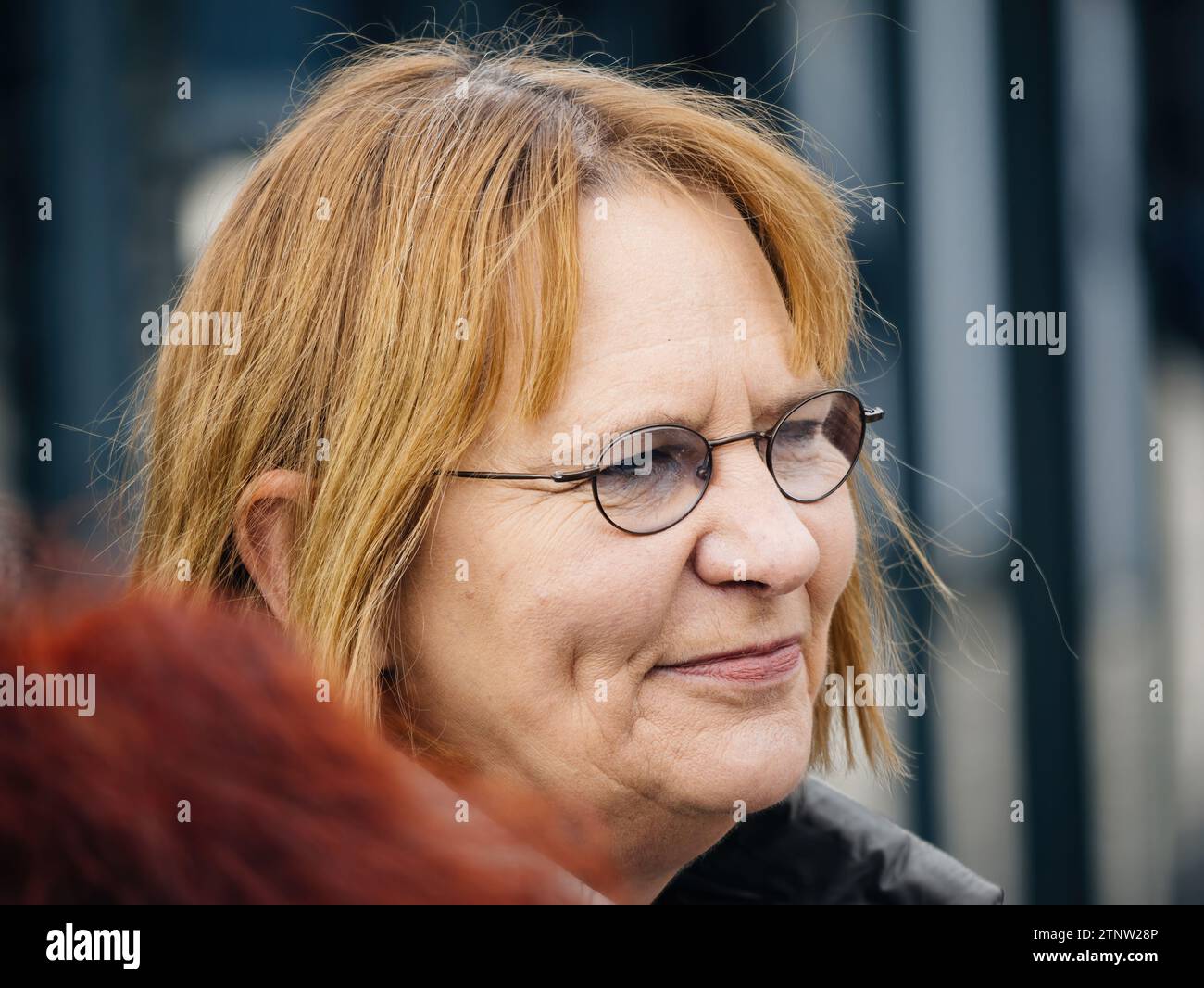 Strasbourg, France - Mar 29, 2023: Portrait of a determined Swiss senior peacefully protest in front of the European Court for Human Rights, holding p Stock Photo