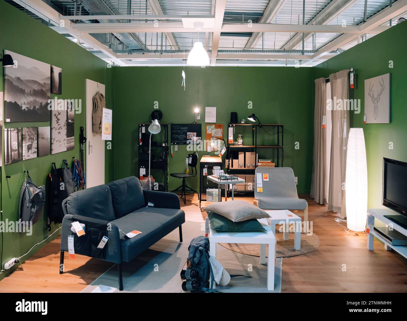 Paris, France - Aug 31, 2023: Explore a modern IKEA furniture store offering ample examples of decorating a teenager's interior room with TV, sofa, an Stock Photo