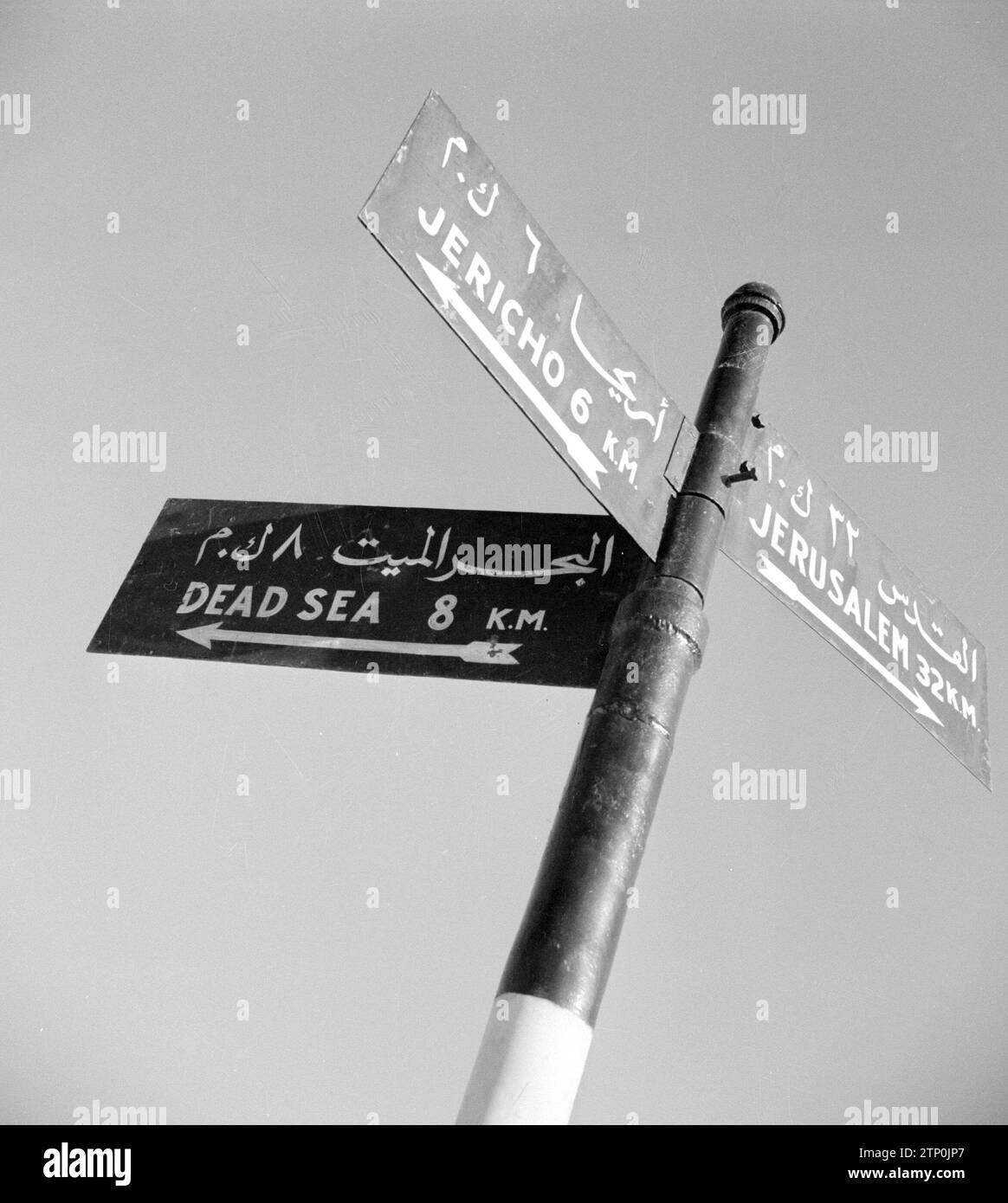 Directional sign on the road from Jerusalem to Jericho, branching off to the Dead Sea ca. 1950-1955 Stock Photo