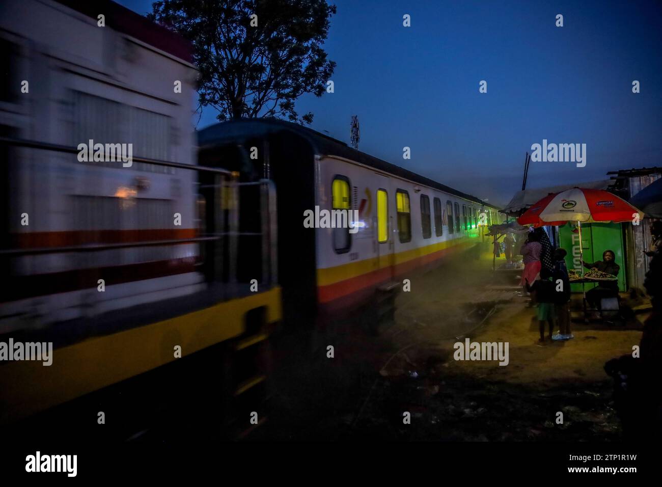 The late evening Nairobi to Kisumu passenger train drives past Kibera Slum in Nairobi. A view