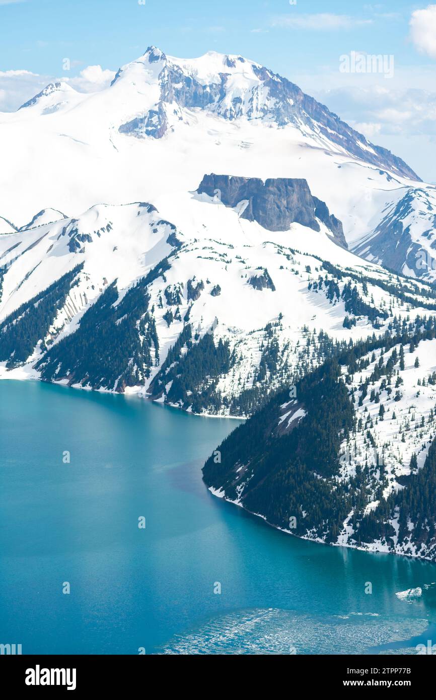 Serene Garibaldi Lake nestled among British Columbia's snowy peaks Stock Photo