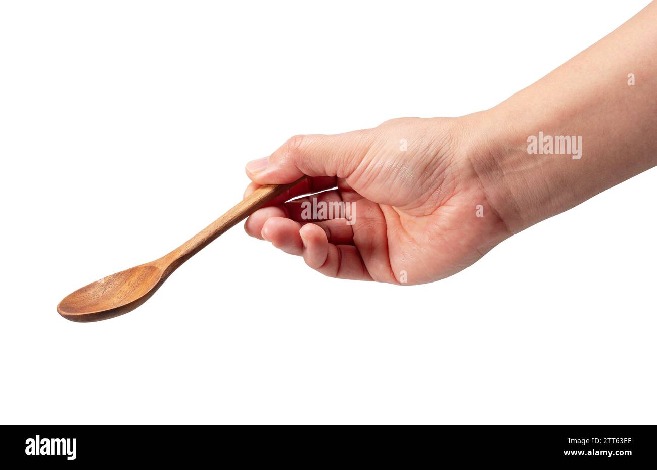 Wooden spoon in men's hand isolated on white background Stock Photo