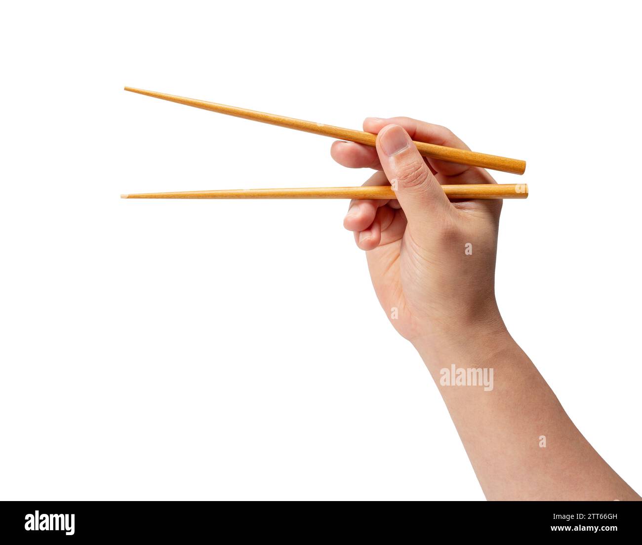 Wooden chopsticks in hand isolated on white background. Stock Photo