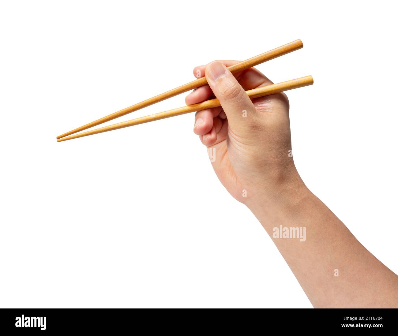Wooden chopsticks in hand isolated on white background. Stock Photo