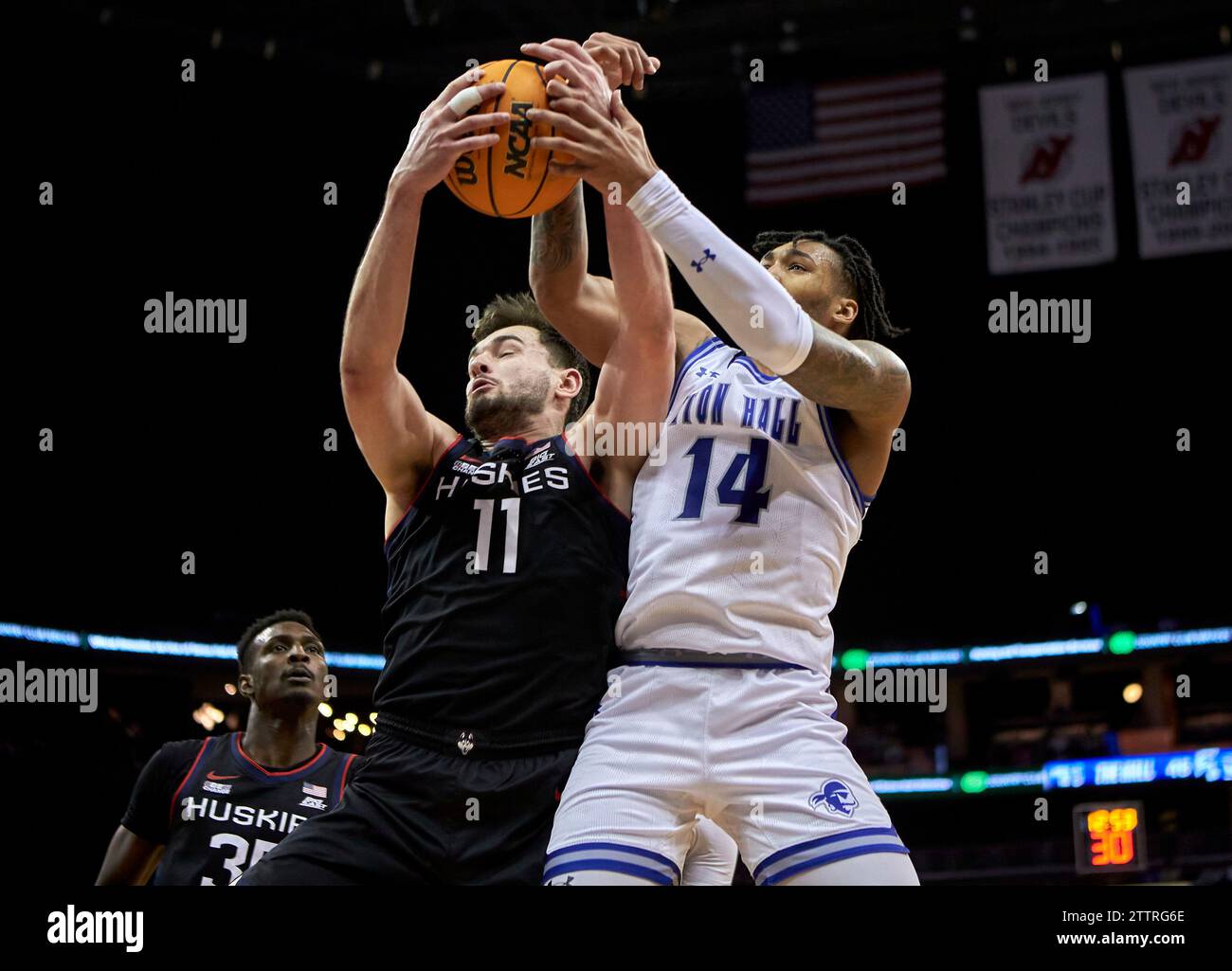 New Jersey on Wednesday, December 20, 2023. Connecticut Huskies forward Alex Karaban (11) and Seton Hall Pirates guard Dre Davis (14) battle for a rebound in the second half during a basketball game at the Prudential Center in Newark, New Jersey on Wednesday, December 20, 2023. Seton Hall defeated UConn 75-60. Duncan Williams/CSM Stock Photo