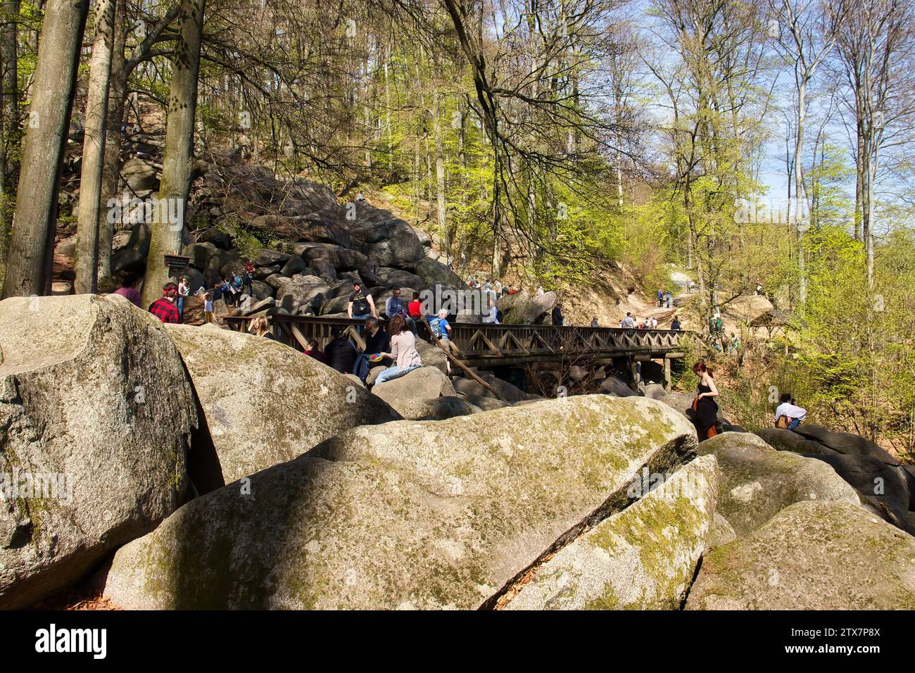 Lautertal, Germany - April 24, 2021: Side of bridge over large rocks on a hill at Felsenmeer on a spring day in Germany. Stock Photo