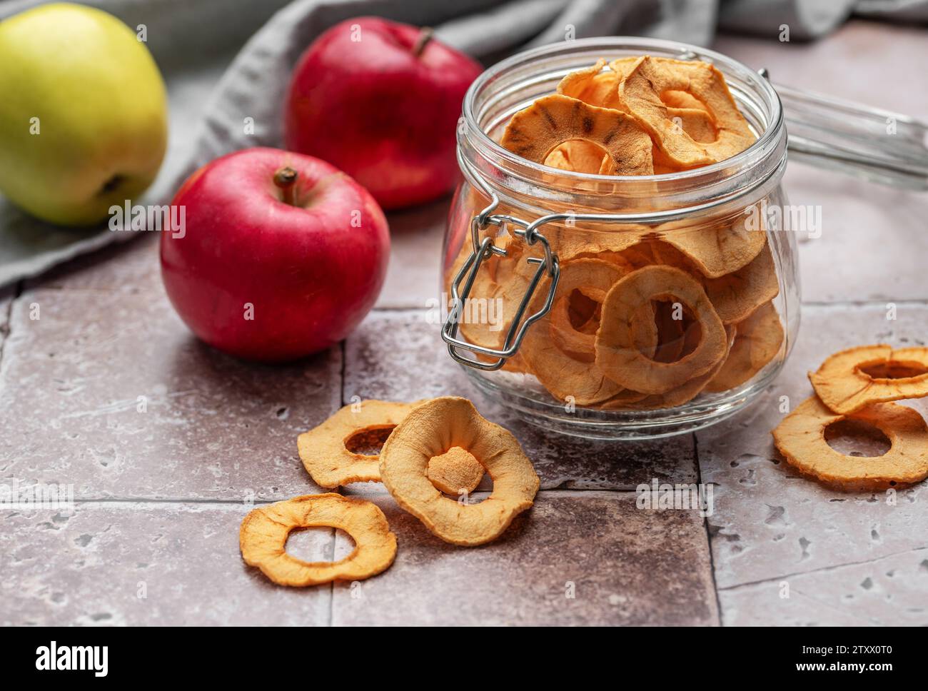 Dried apple chips. Dehydrated apples. Homemade dried organic apple sliced. Stock Photo