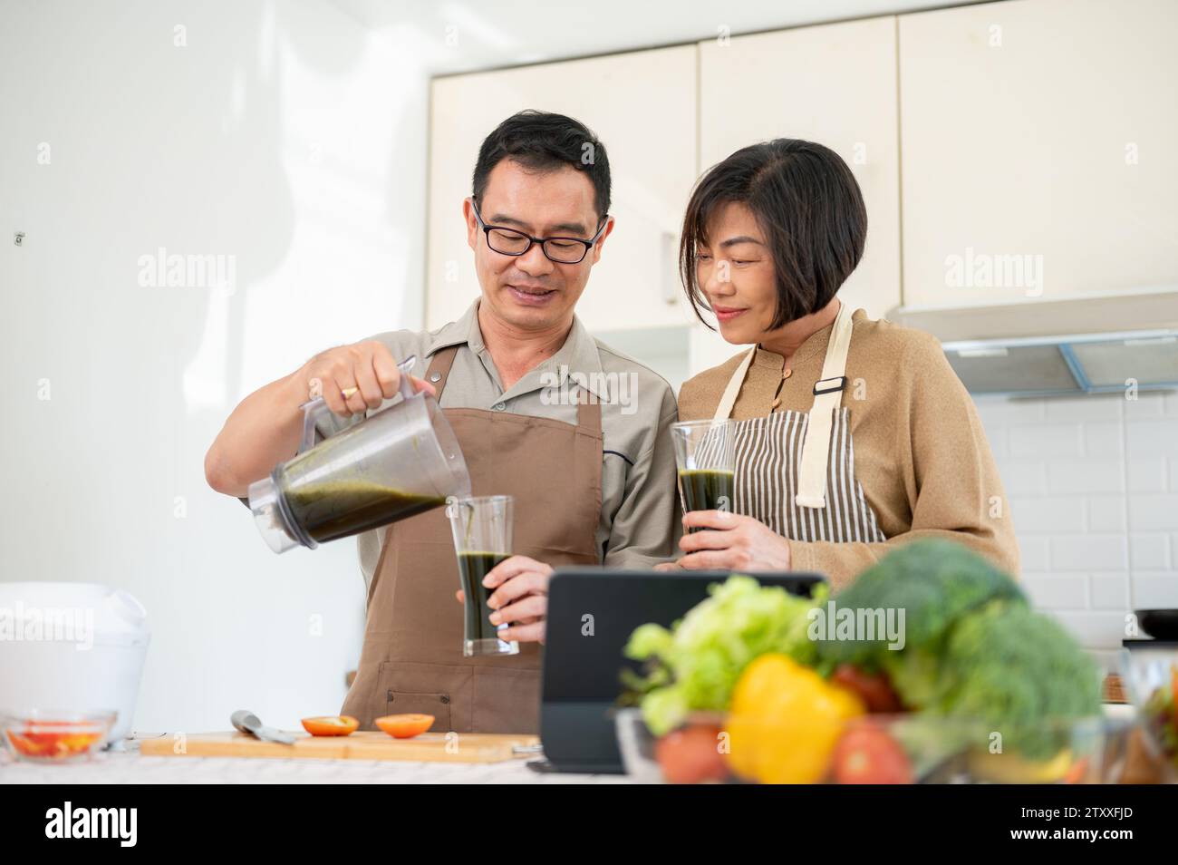 Happy adult asian couples hi-res stock photography and images - Alamy