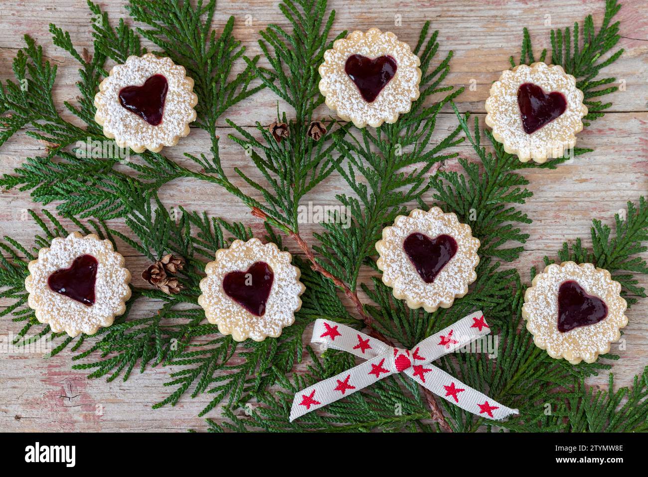 christmas bakery biscuits Spitzbuben with red jam Stock Photo