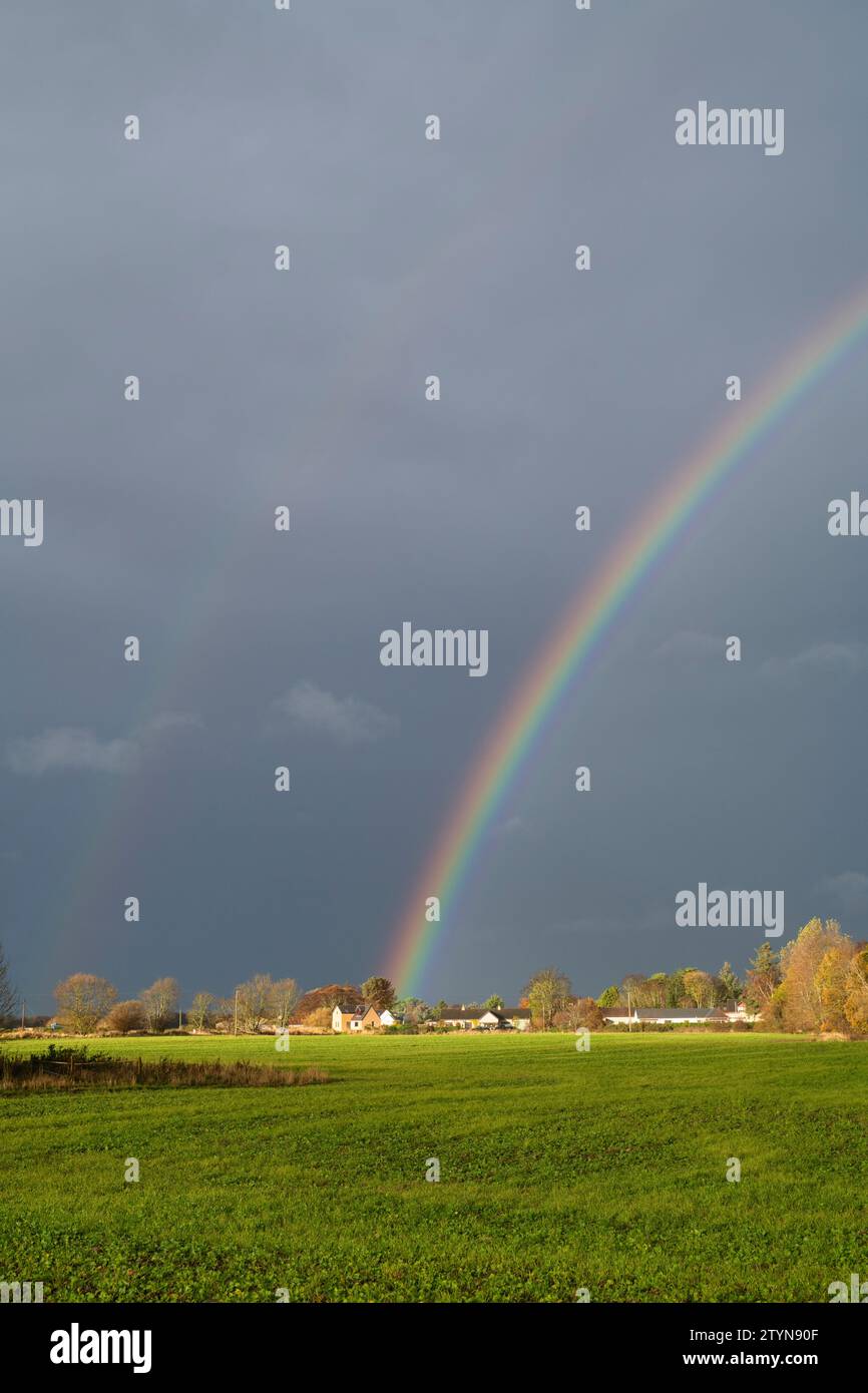 Rainbow in the dark sky at Bogmoor, Morayshire, Scotland Stock Photo