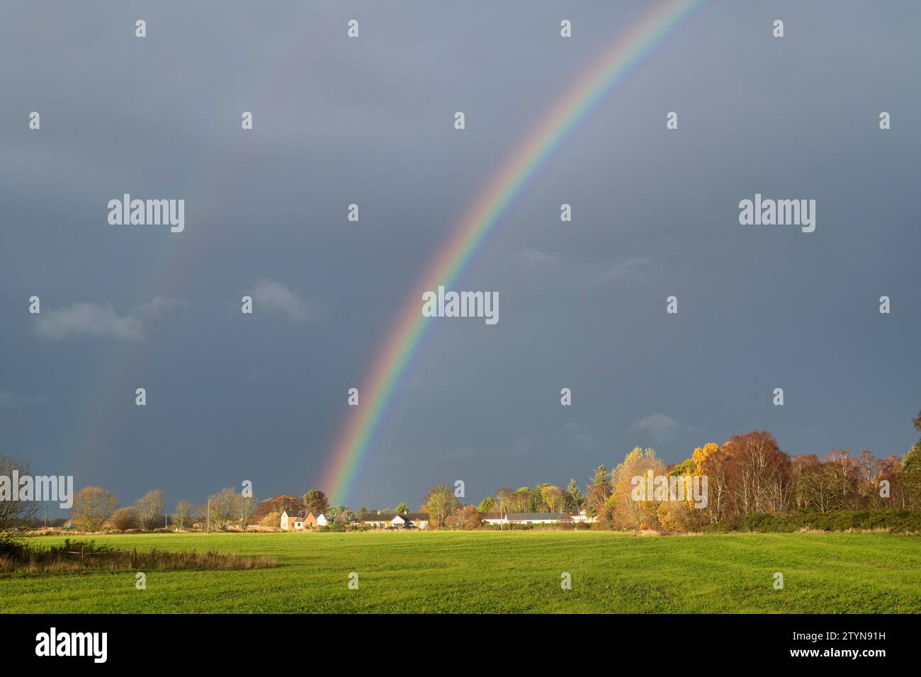 Rainbow in the dark sky at Bogmoor, Morayshire, Scotland Stock Photo