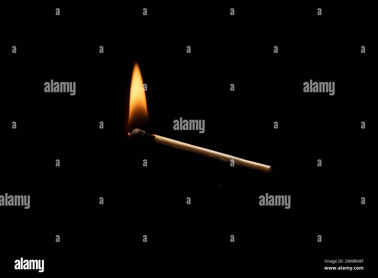 Lit and falling match on a black background Stock Photo - Alamy
