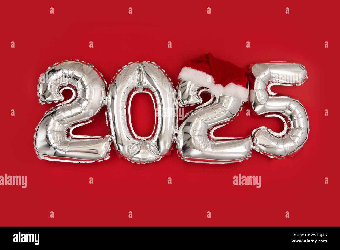 2025 inflatable balloons on red background with santa hat happy new